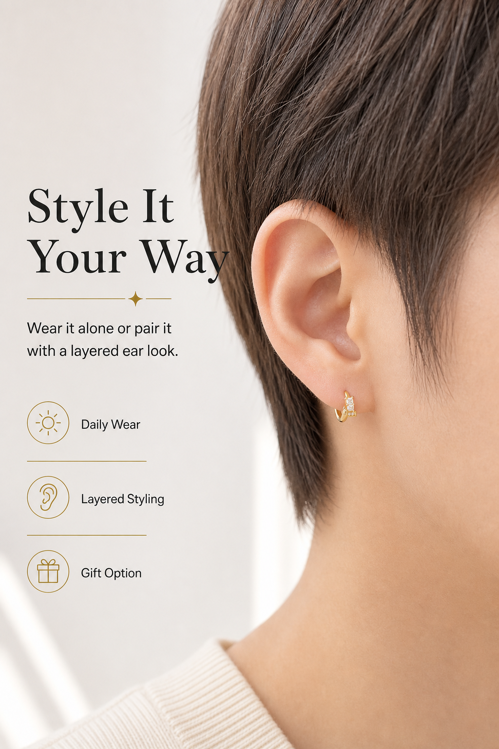 model wearing single huggie earring for curated ear styling